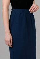 Model wearing Nuggles® 34" Pocket Classic Skirt in Dark Navy
