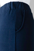 Model wearing Nuggles® 34" Pocket Classic Skirt in Dark Navy