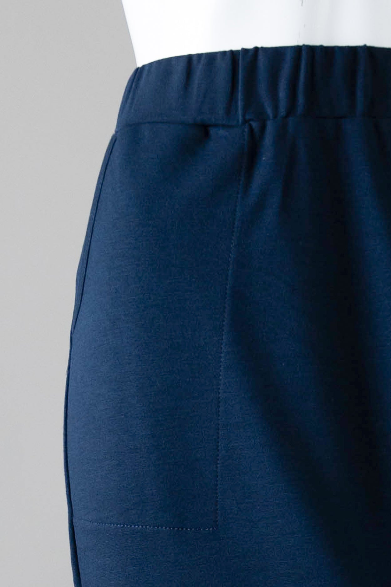 Model wearing Nuggles® 34" Pocket Classic Skirt in Dark Navy