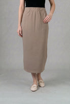 Model wearing Nuggles® 34" Pocket Classic Skirt in Taupe