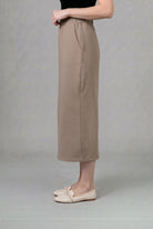 Model wearing Nuggles® 34" Pocket Classic Skirt in Taupe
