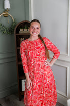 Model wearing Nuggles® Cindy Bubble Dress in Berry Maze