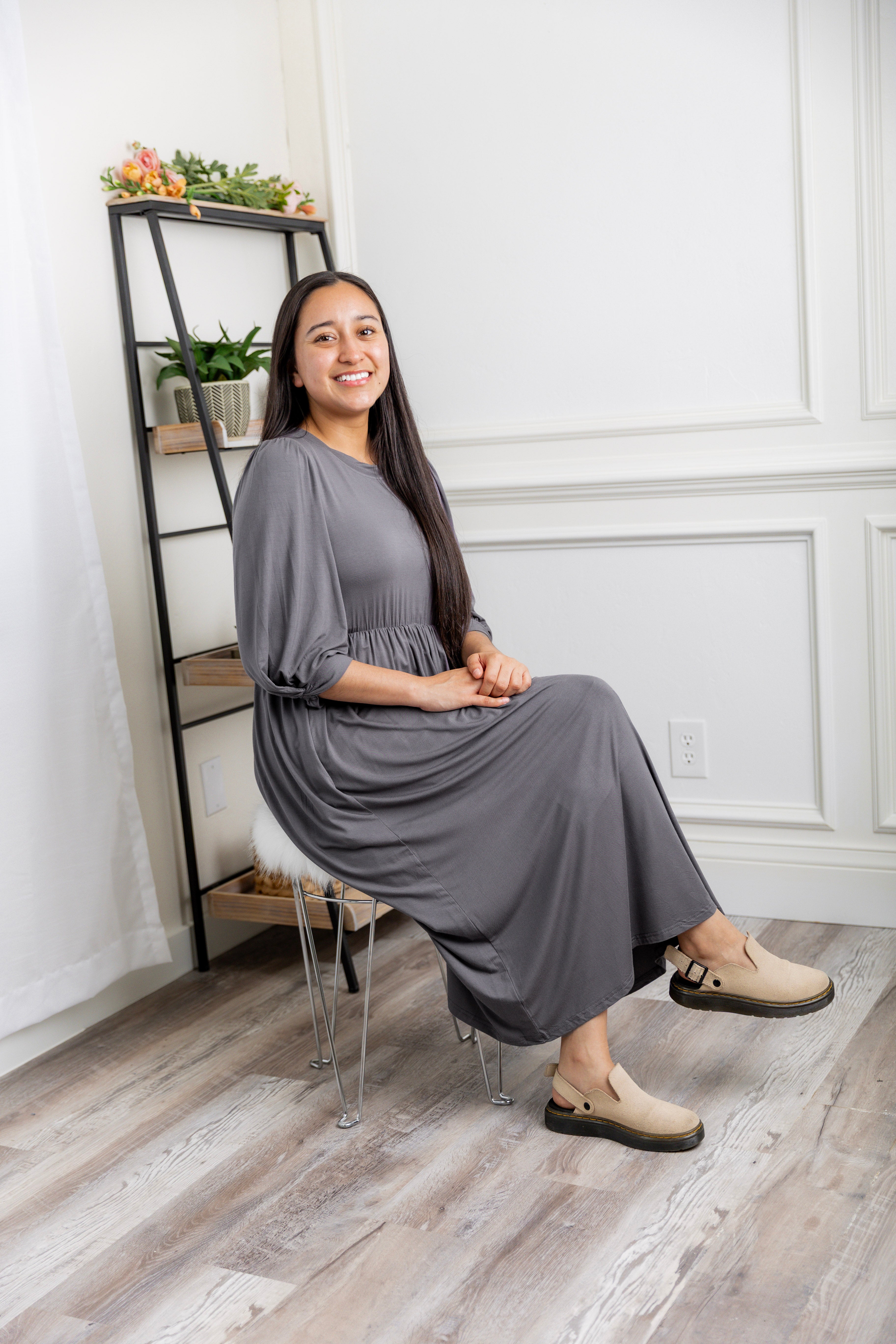 Modest Willow Solid Colors Dress by Nuggles® featuring a gathered waist, balloon sleeves, and side pockets; shown in various solid colors and angles for a stylish, comfortable everyday look.
