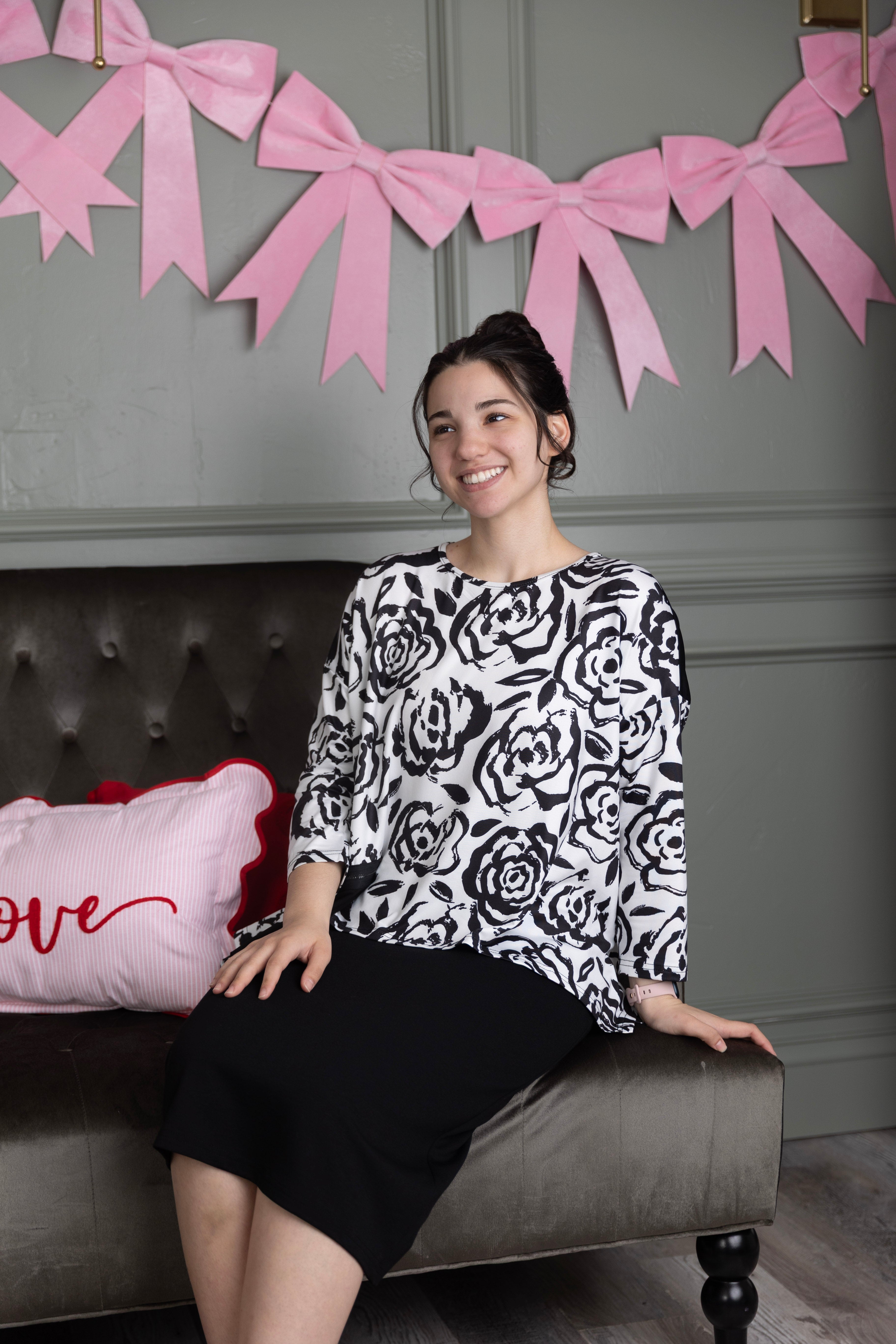 Model wearing the Nuggles® Keegan Top in  Midnight Rose print modest boutique top