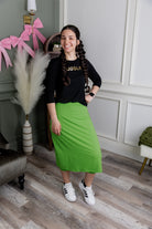 Model wearing Nuggles® 27" All-Sport Skirt in Green