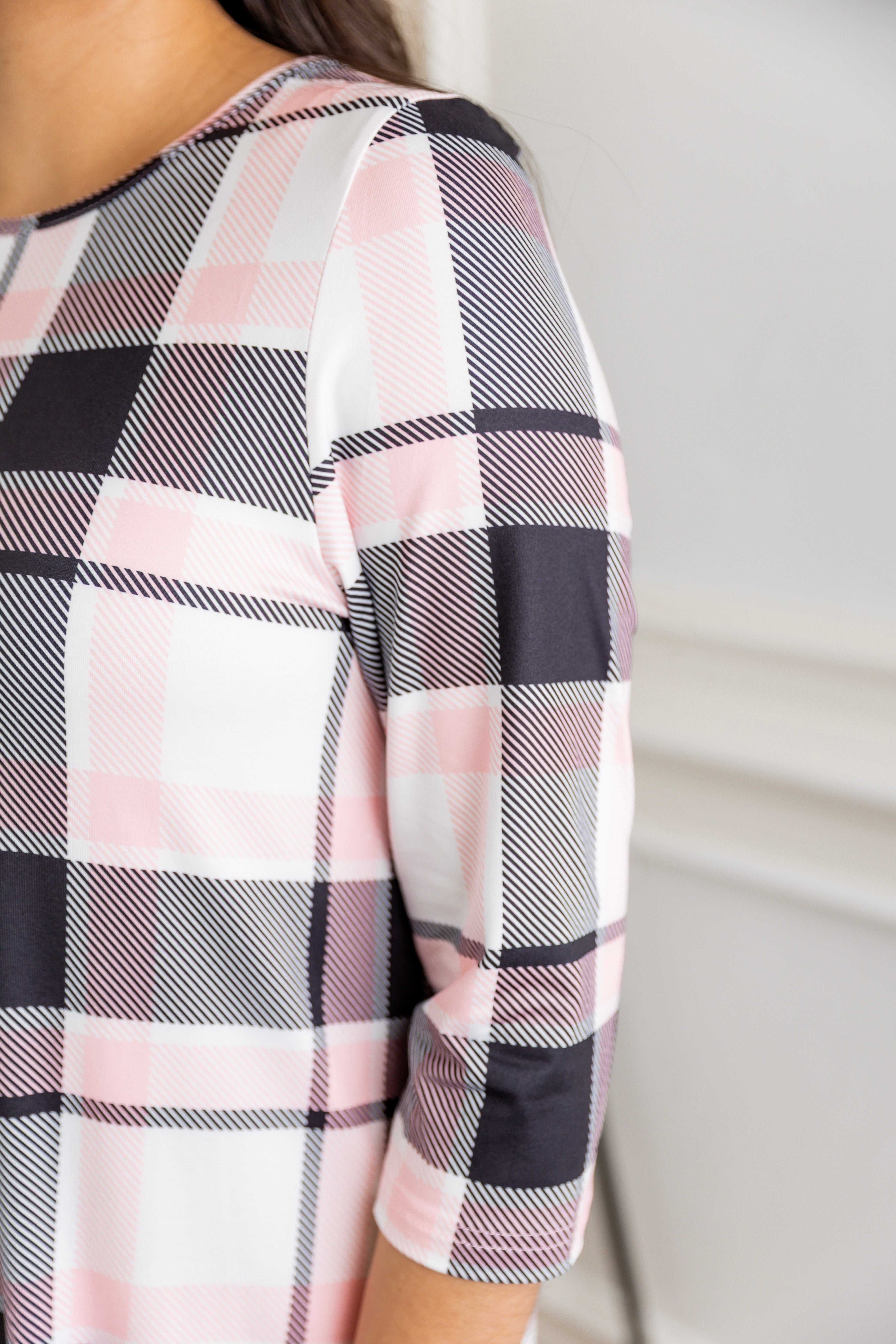 Model wearing our Nuggles® modest Bristol midi dress with 3/4 sleeves and elastic ruffle hem in various prints.