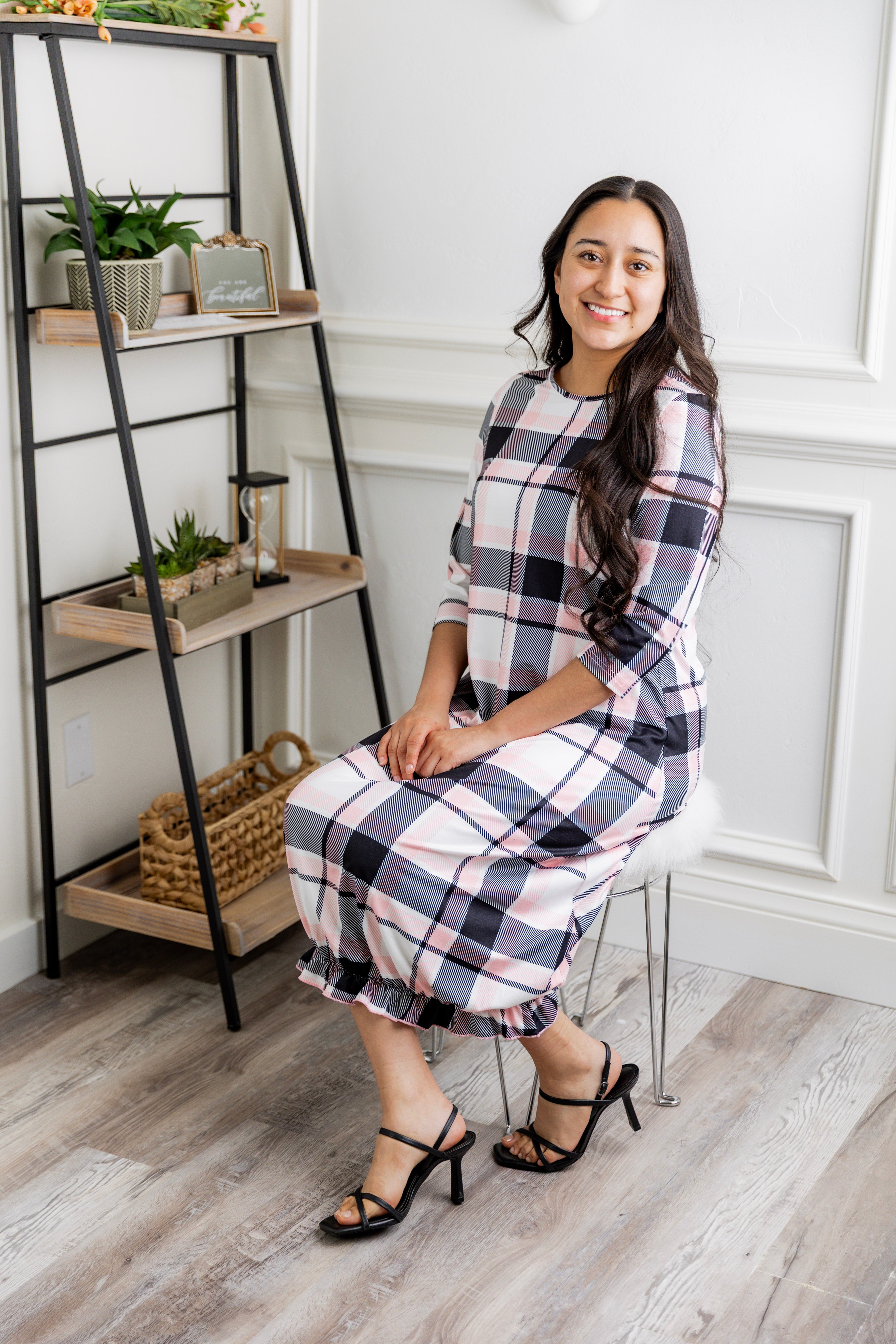 Model wearing our Nuggles® modest Bristol midi dress with 3/4 sleeves and elastic ruffle hem in various prints.