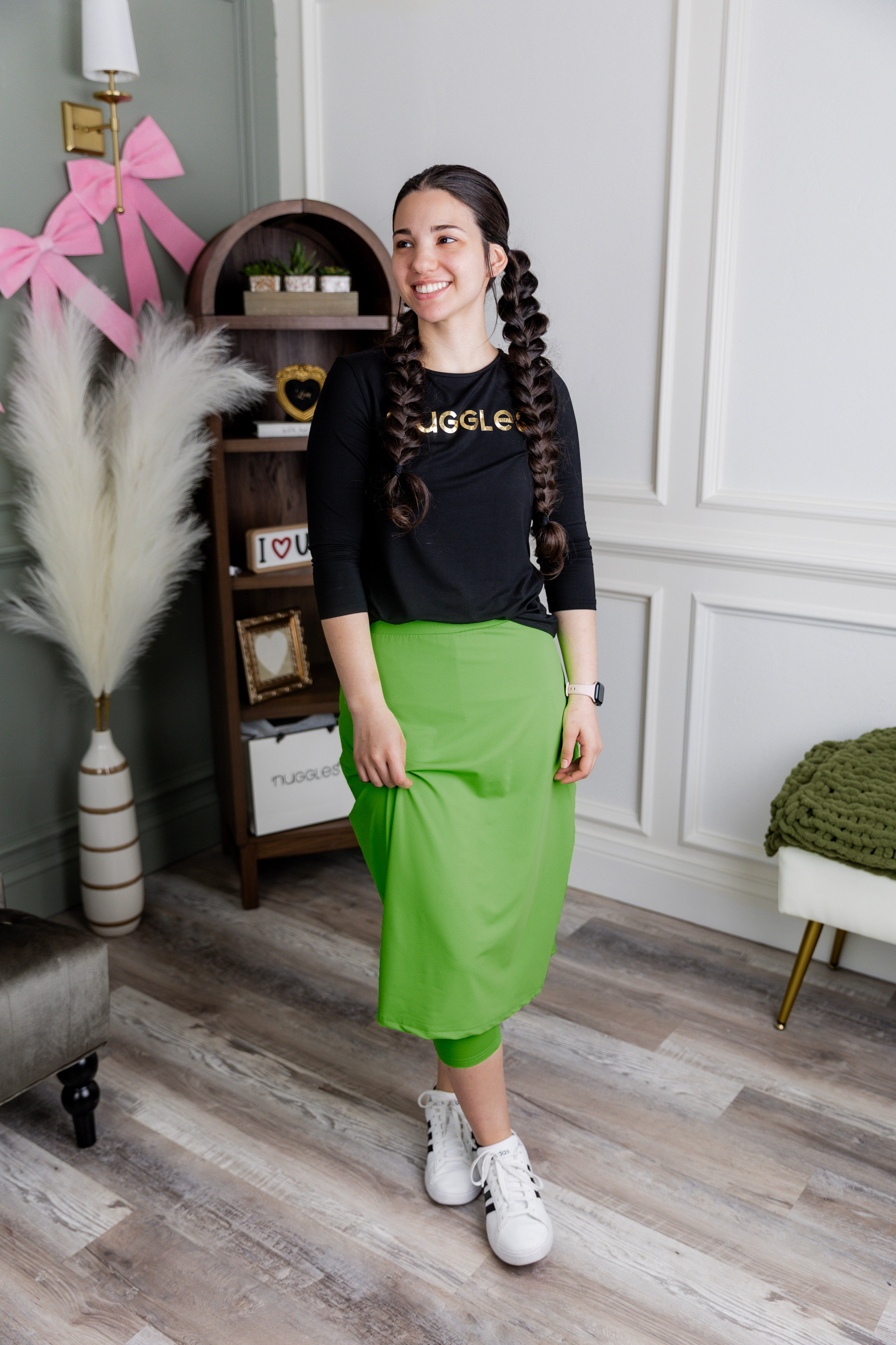 Model wearing Nuggles® 27" All-Sport Skirt in Green