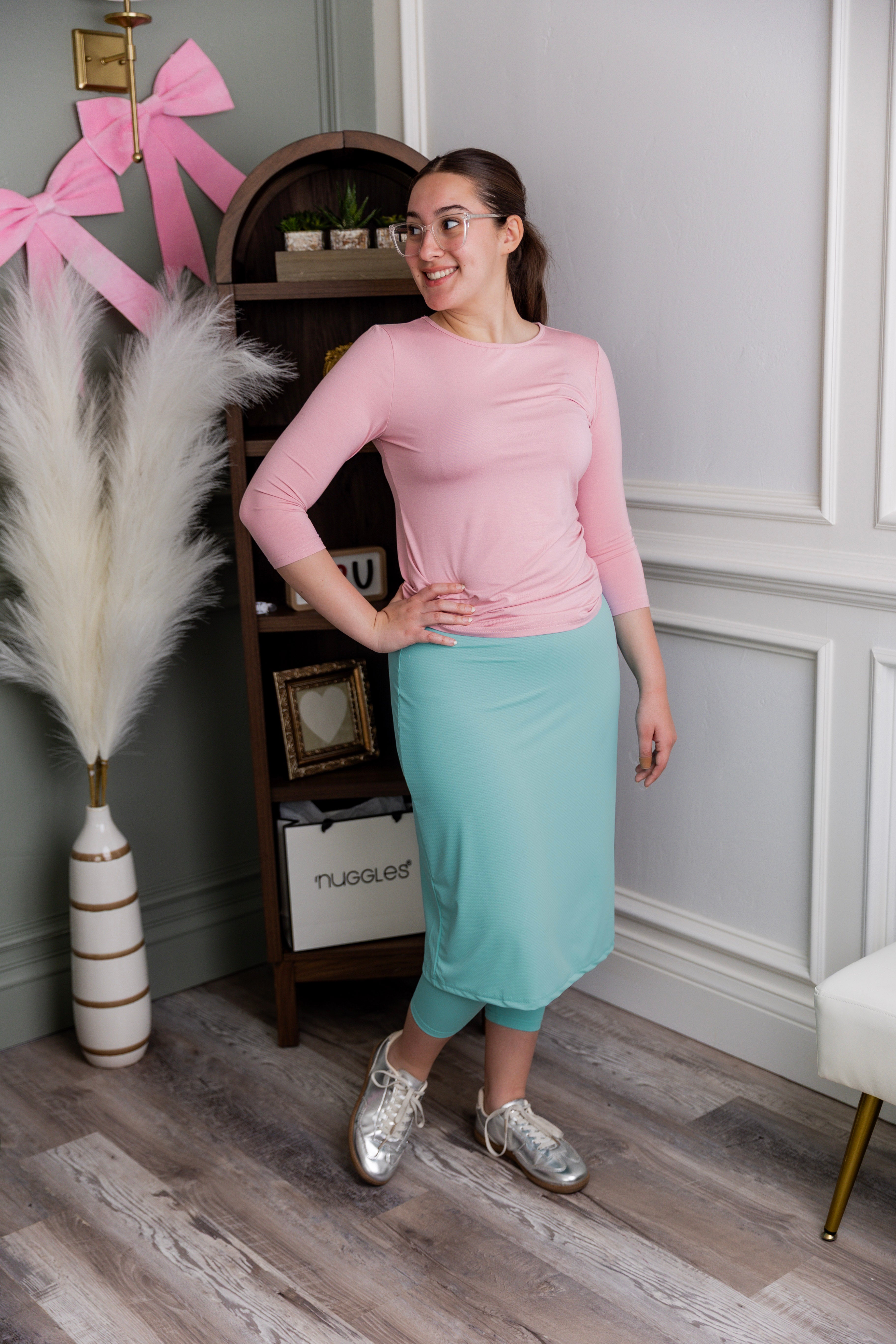 Model wearing Nuggles® 27" All-Sport Skirt in Aqua