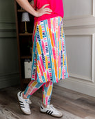 Model wearing Nuggles® Tilly Sport Skirt in Color Splash
