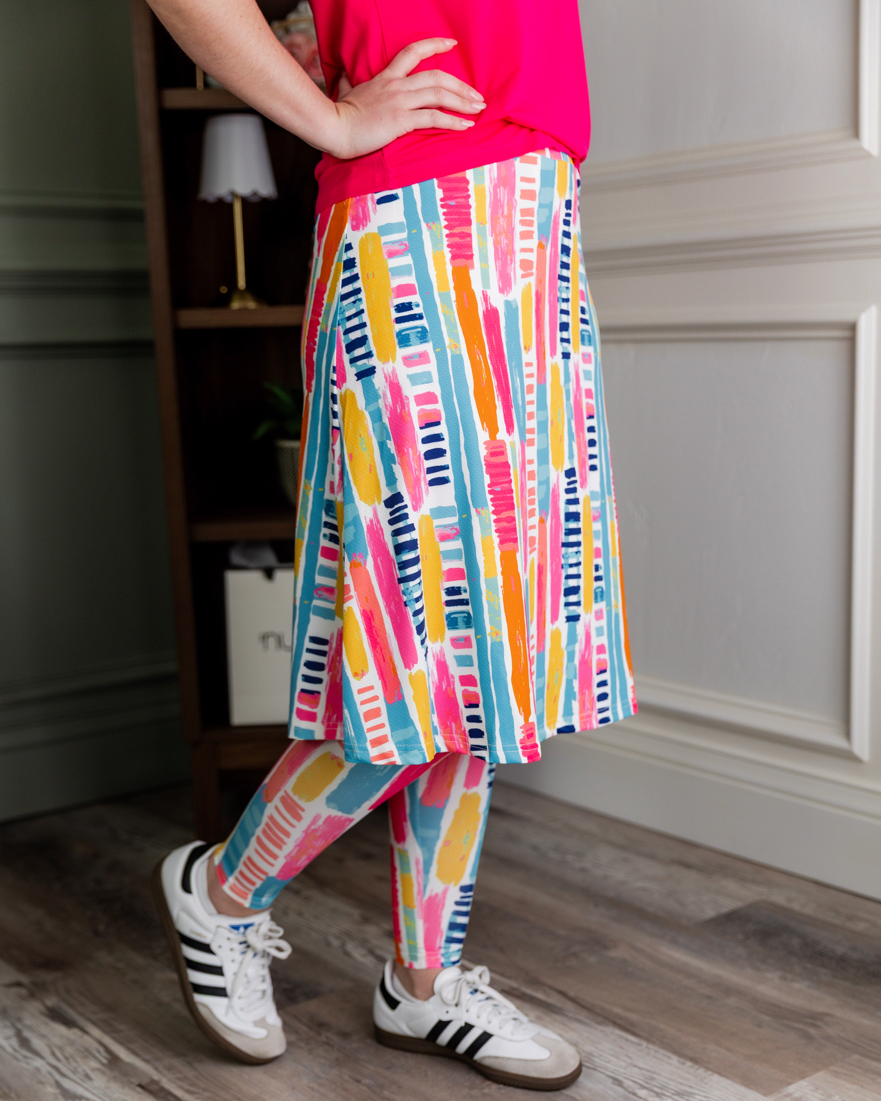 Model wearing Nuggles® Tilly Sport Skirt in Color Splash