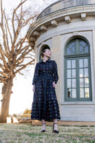 Model wearing the Nuggles® Leila Dress in Tiny Skipper