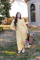 Model wearing the Nuggles® Leila Dress in Sunshine Check