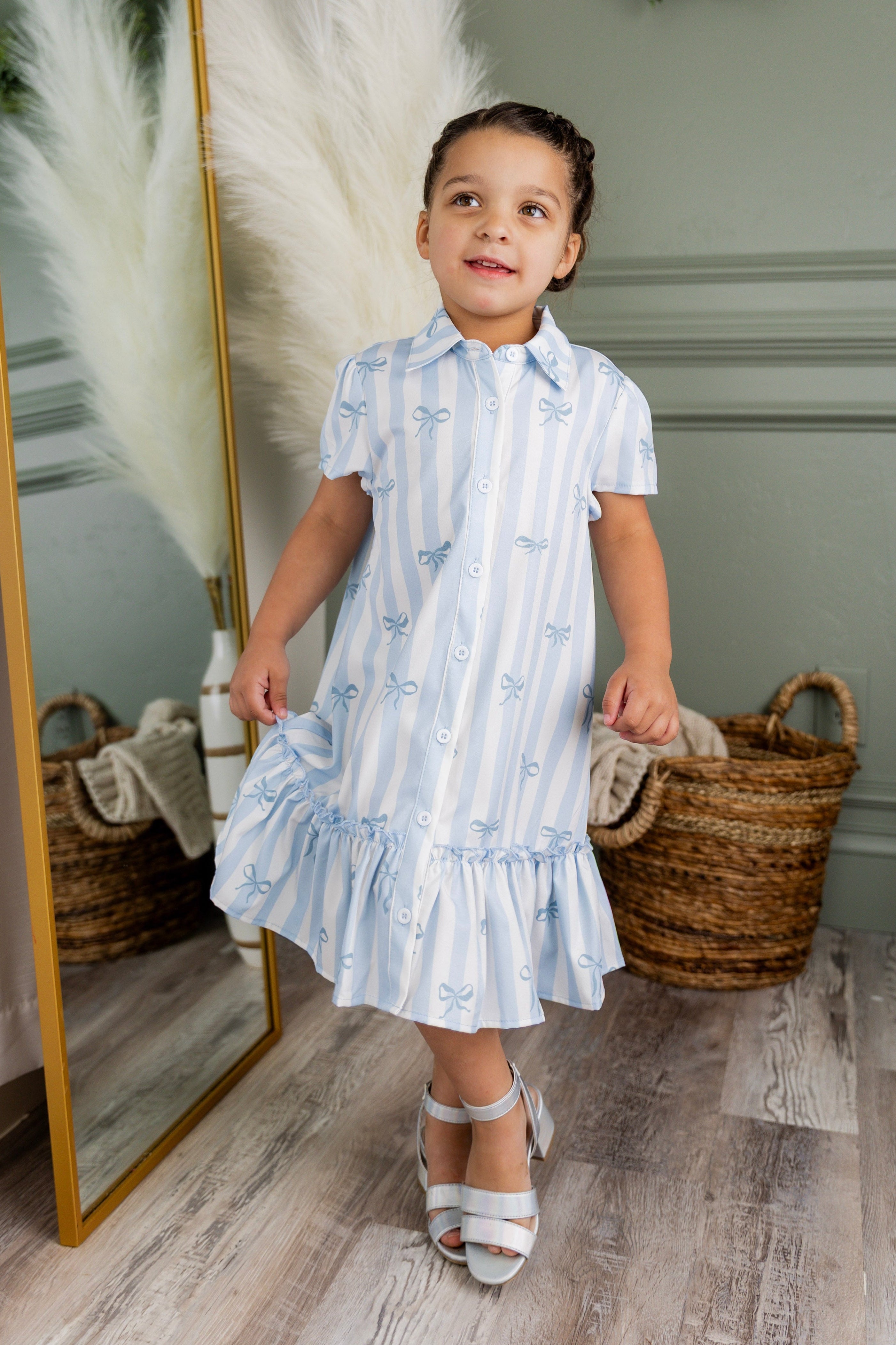 Model wearing Nuggles® Girls' Ellie Dress Dress in Sweet Ribbon Stripe