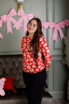 Model wearing Nuggles® Essential Long Sleeve Tee in Red Petal Party