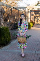 Model wearing the Nuggles® Original Midi Layering Dress in Wildflower Haze