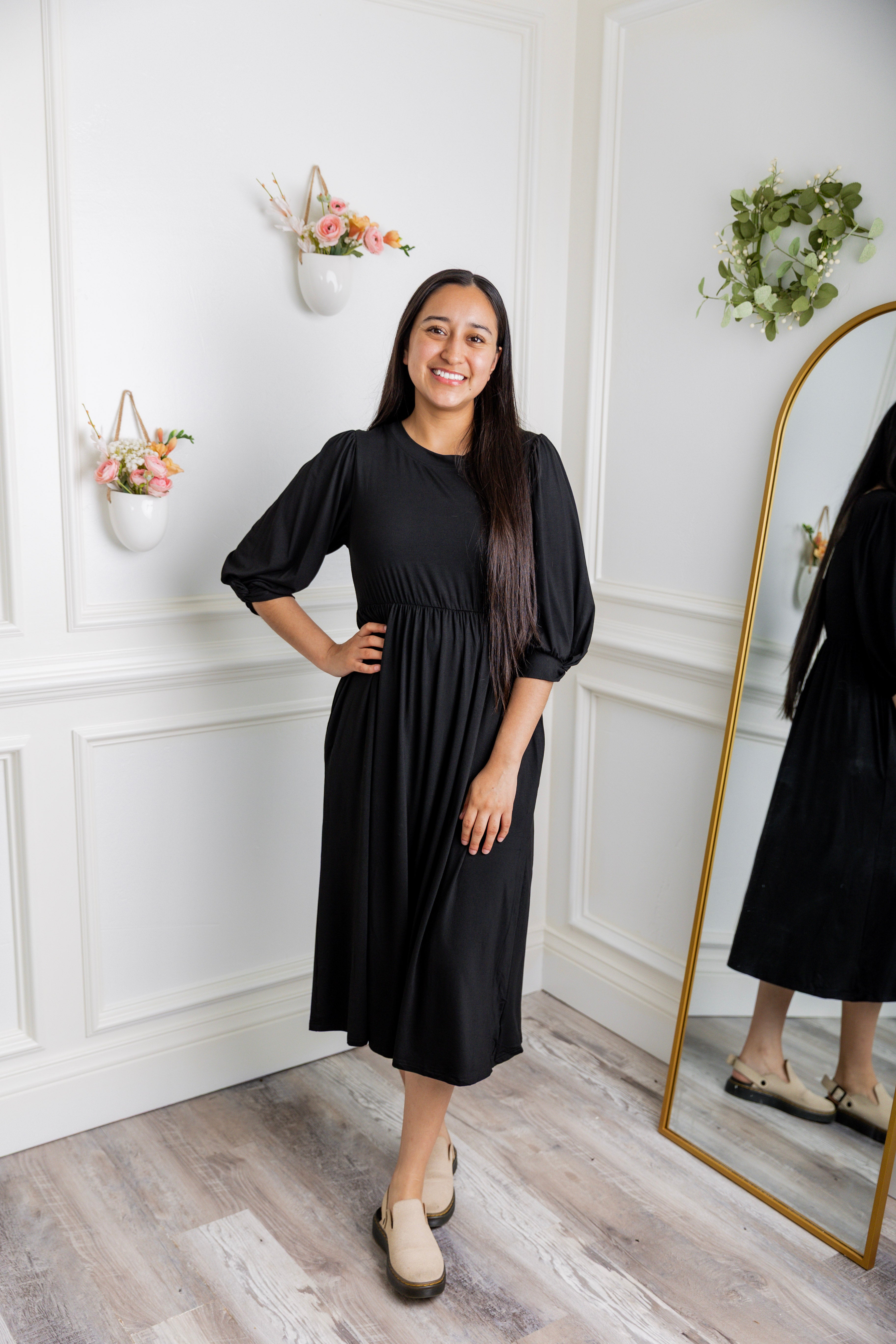 Modest Willow Solid Colors Dress by Nuggles® featuring a gathered waist, balloon sleeves, and side pockets; shown in various solid colors and angles for a stylish, comfortable everyday look.