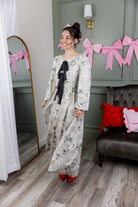 Model wearing the Nuggles® Addison Dress in Whispering Headlines