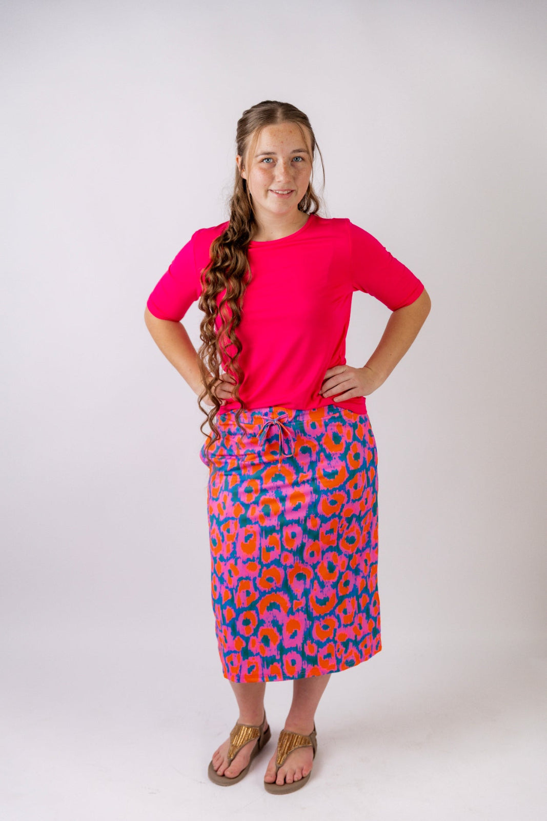 Model wearing the Nuggles® Essential Half Sleeve Tee in Hot Pink