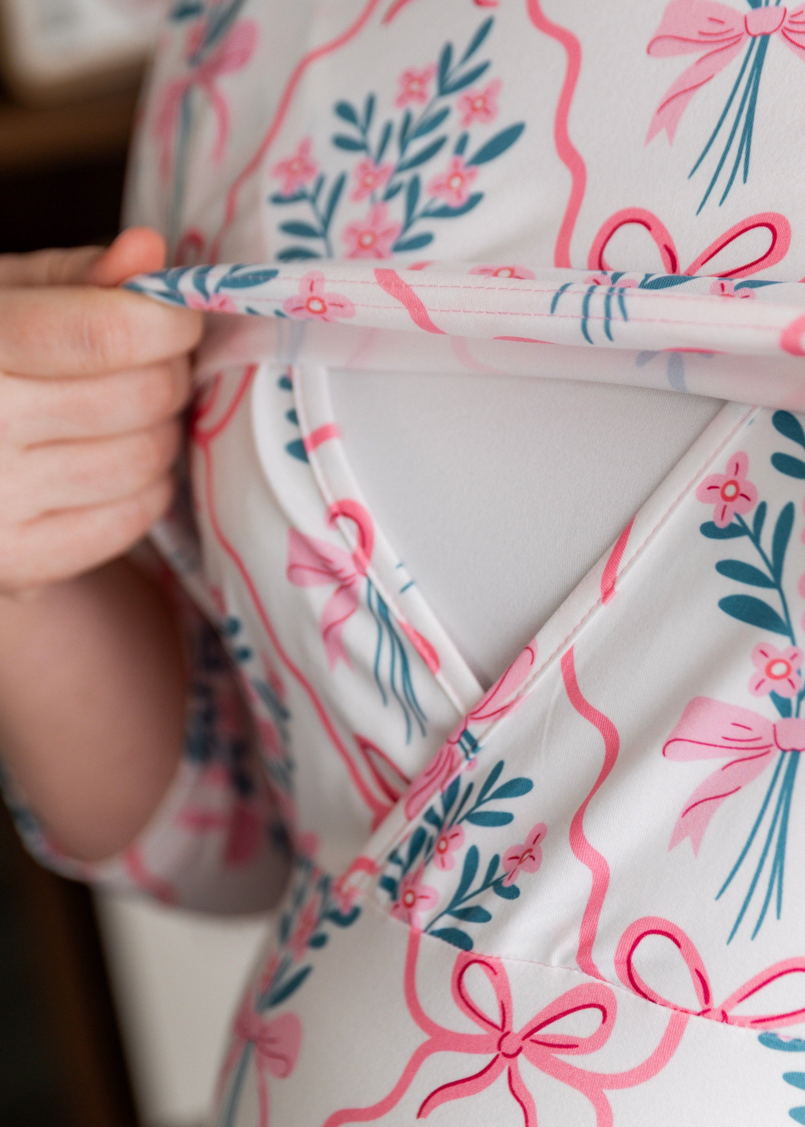 Model wearing Nuggles® Nalani Nursing Dress in Pixie Petals 