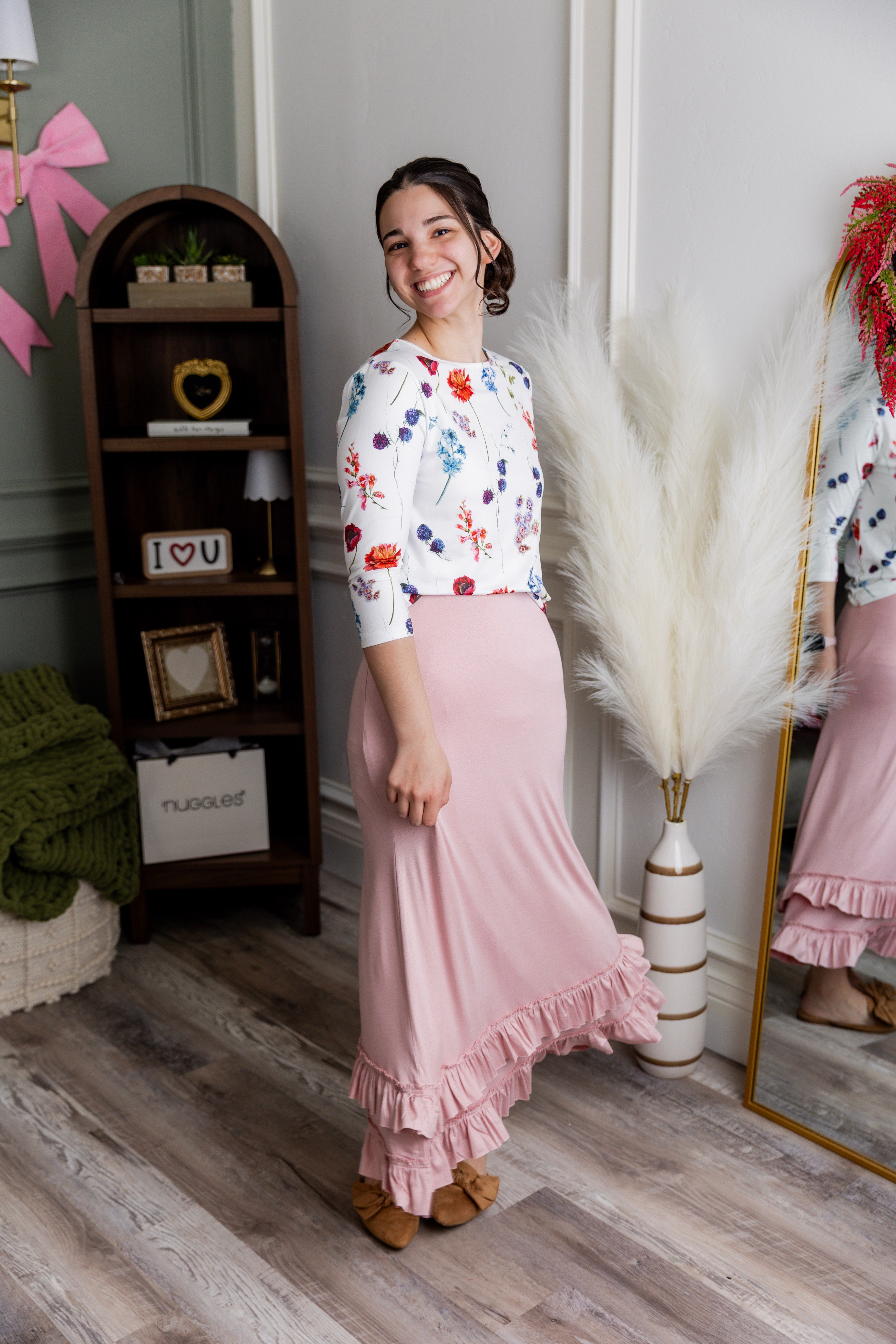 Model wearing Nuggles® Callie Skirt in Baby Pink Modest skirt