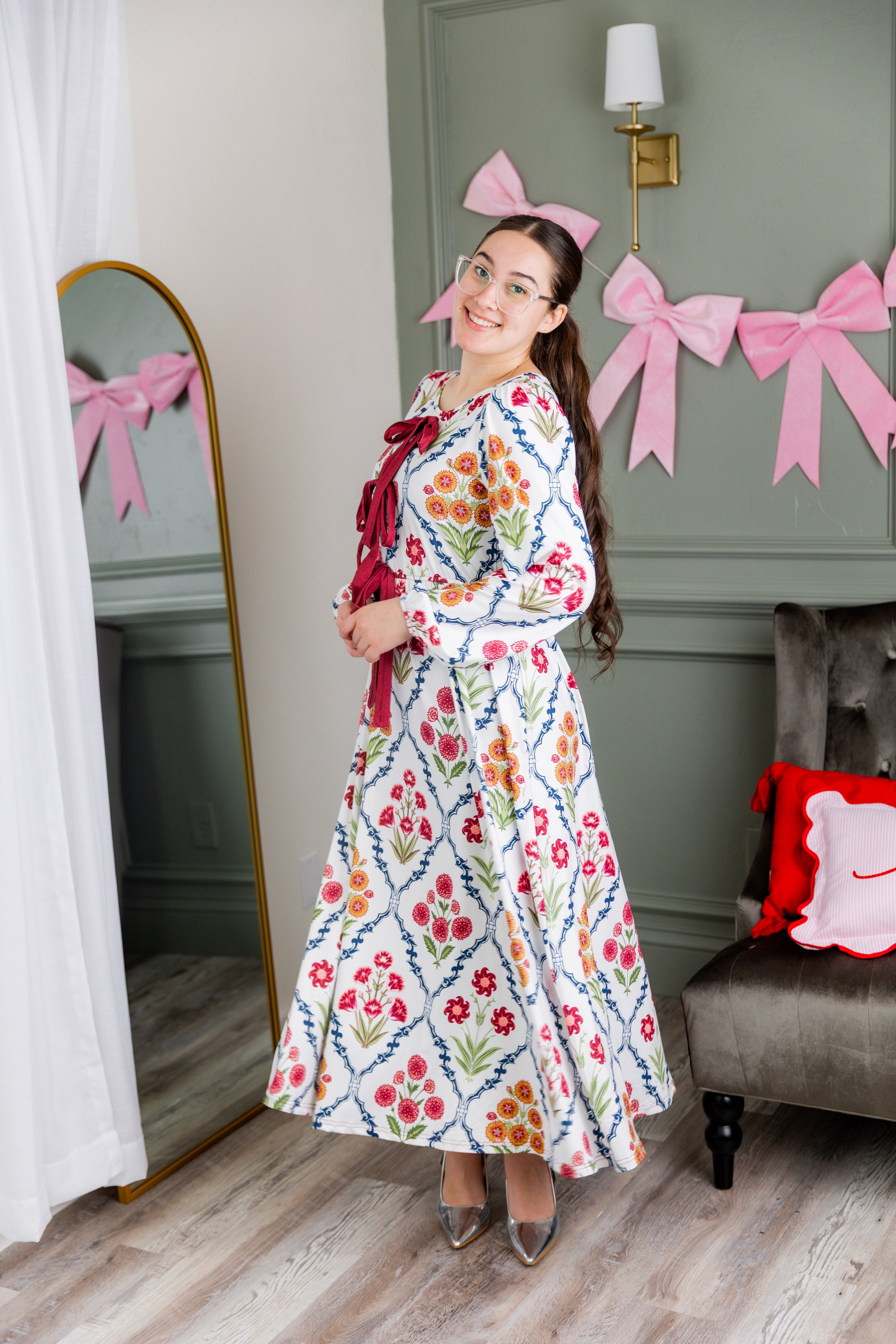 Model wearing the Nuggles® Addison Dress in Wildflower Trellis