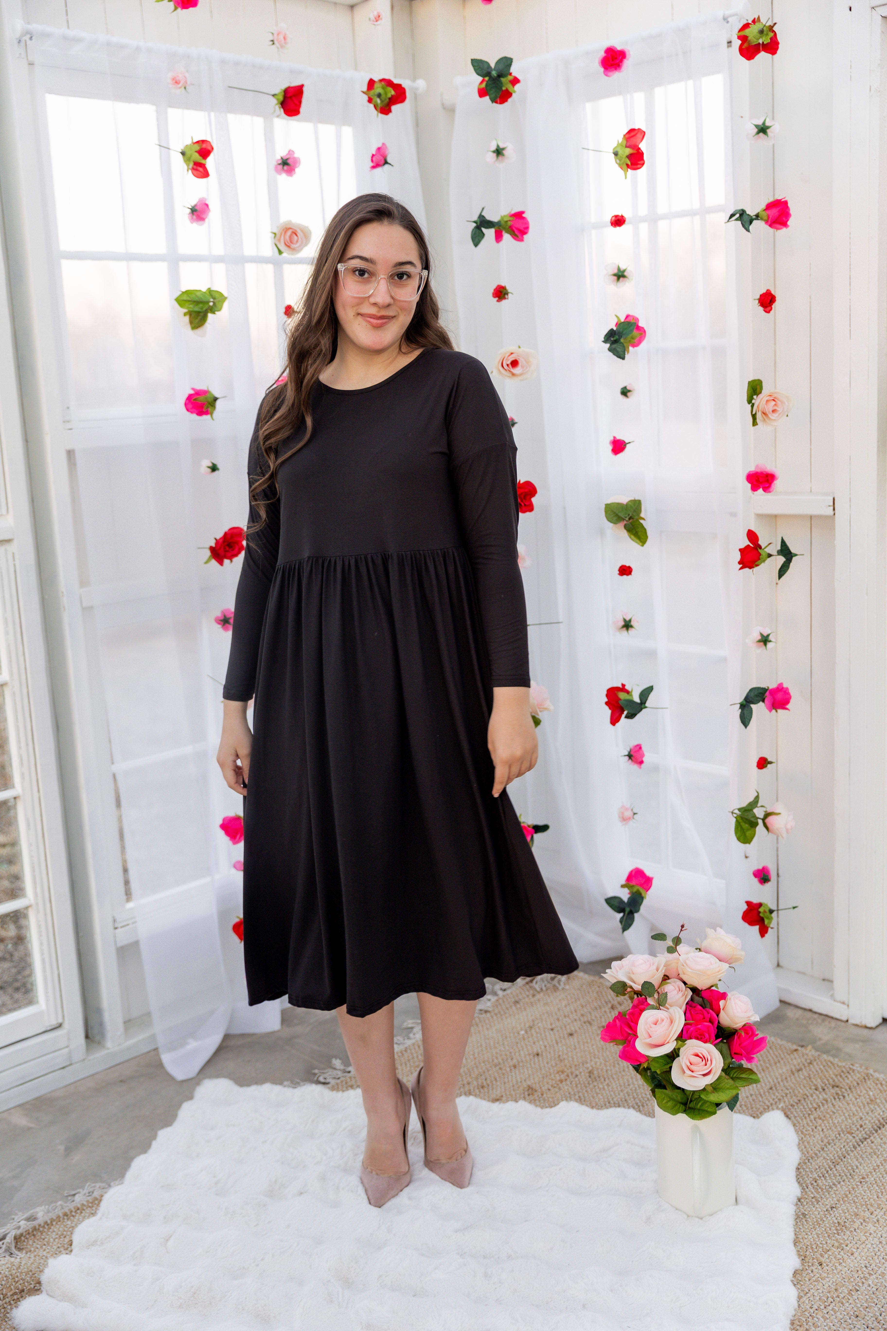 Model wearing the Nuggles® Farah Dress in Black 