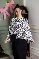Model wearing the Nuggles® Keegan Top in  Midnight Rose print modest boutique top