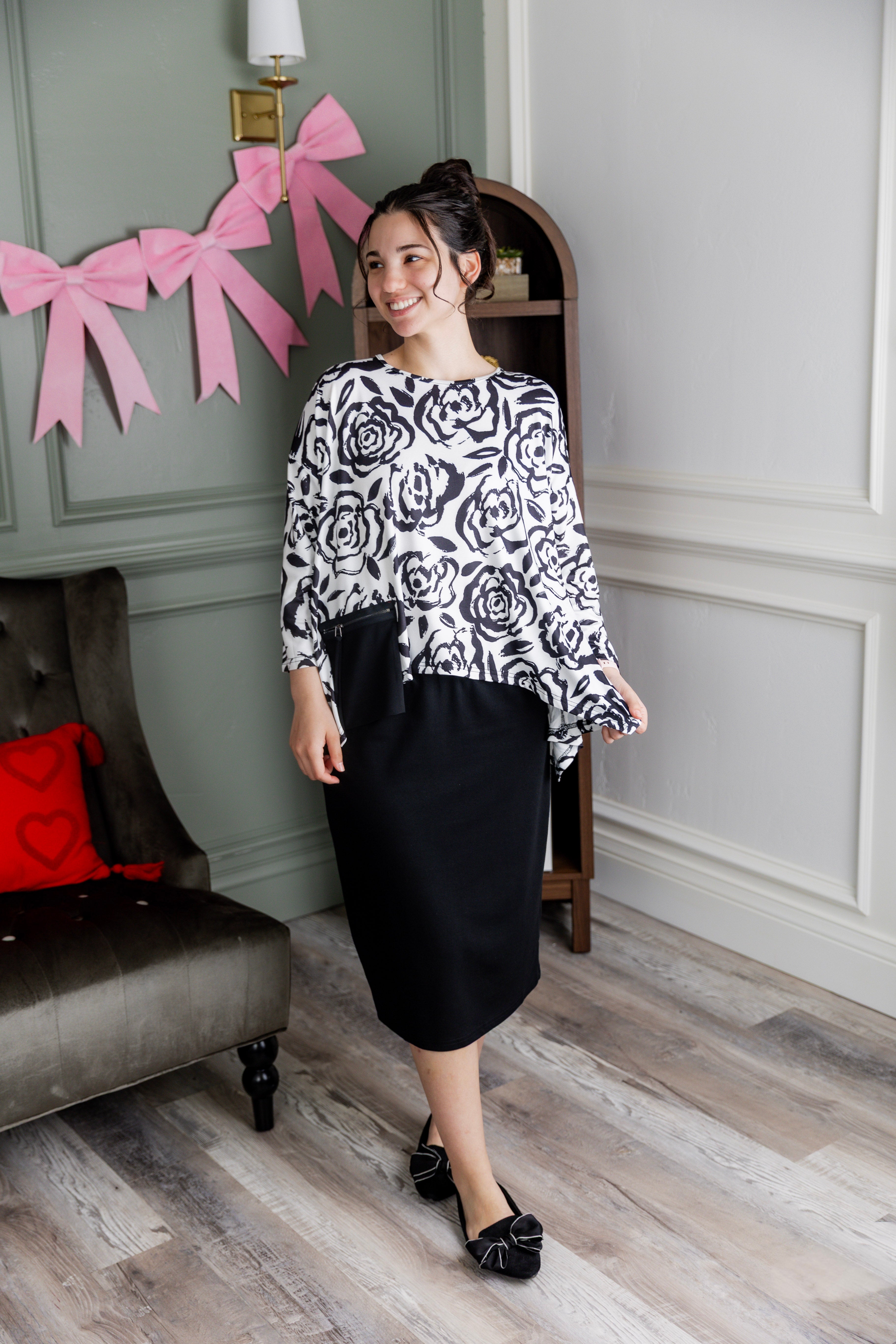 Model wearing the Nuggles® Keegan Top in  Midnight Rose print modest boutique top