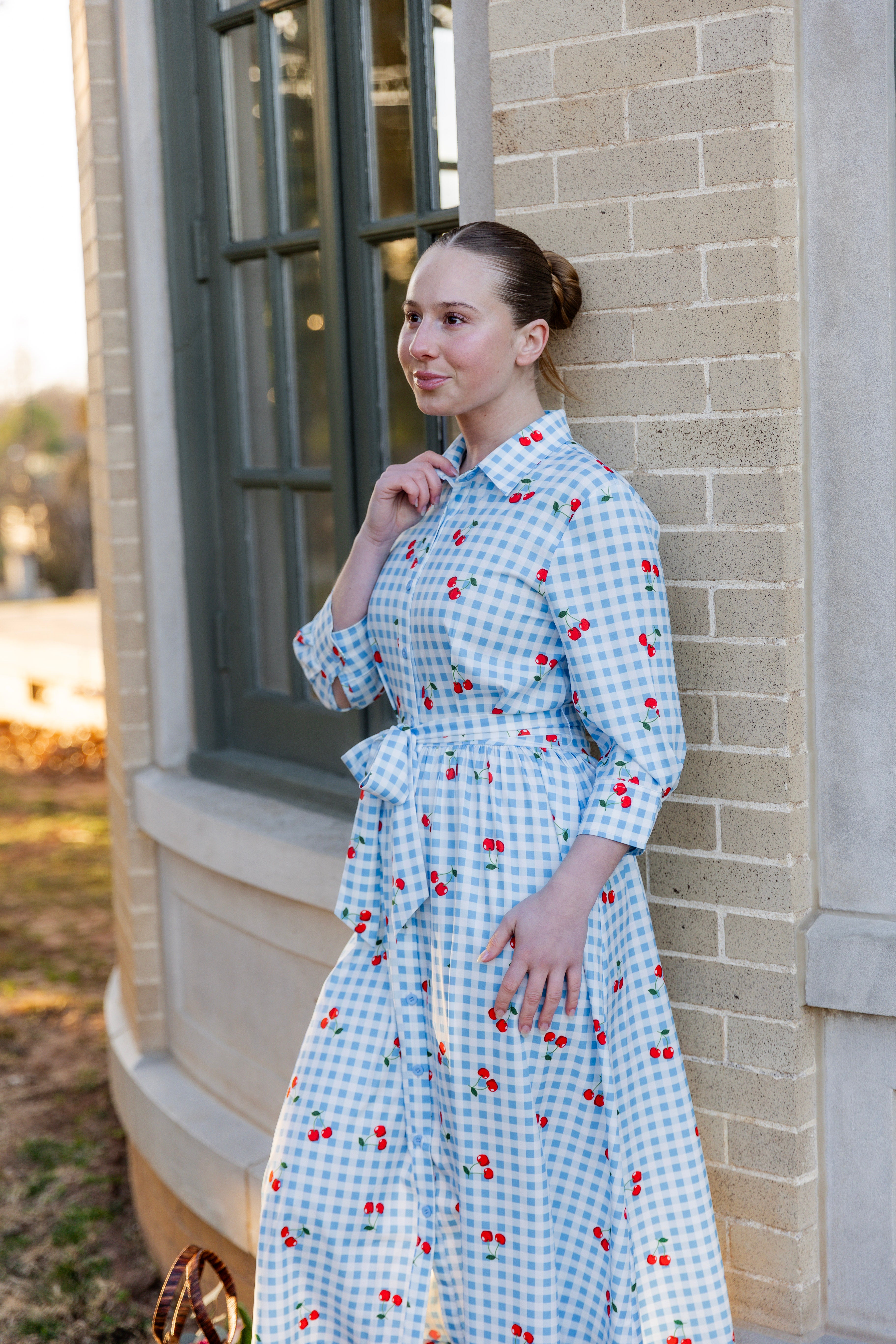 Model wearing the Nuggles® Rachel Dress in Sweet Cherry Check