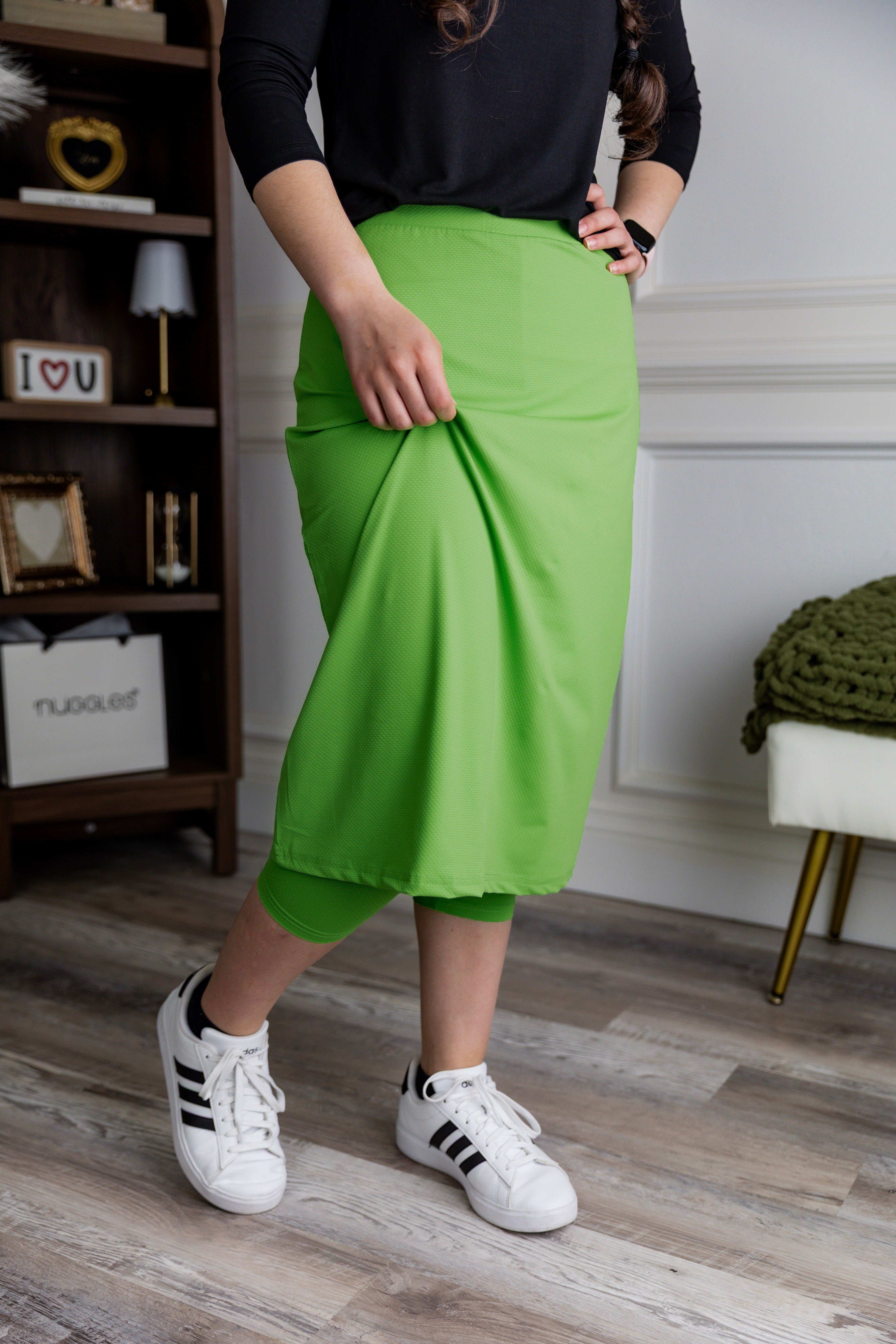 Model wearing Nuggles® 27" All-Sport Skirt in Green