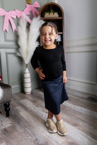 Model wearing Nuggles® Girls' All-Sport Skirt in Navy