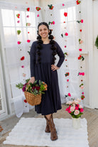 Model wearing the Nuggles® Farah Dress in Navy