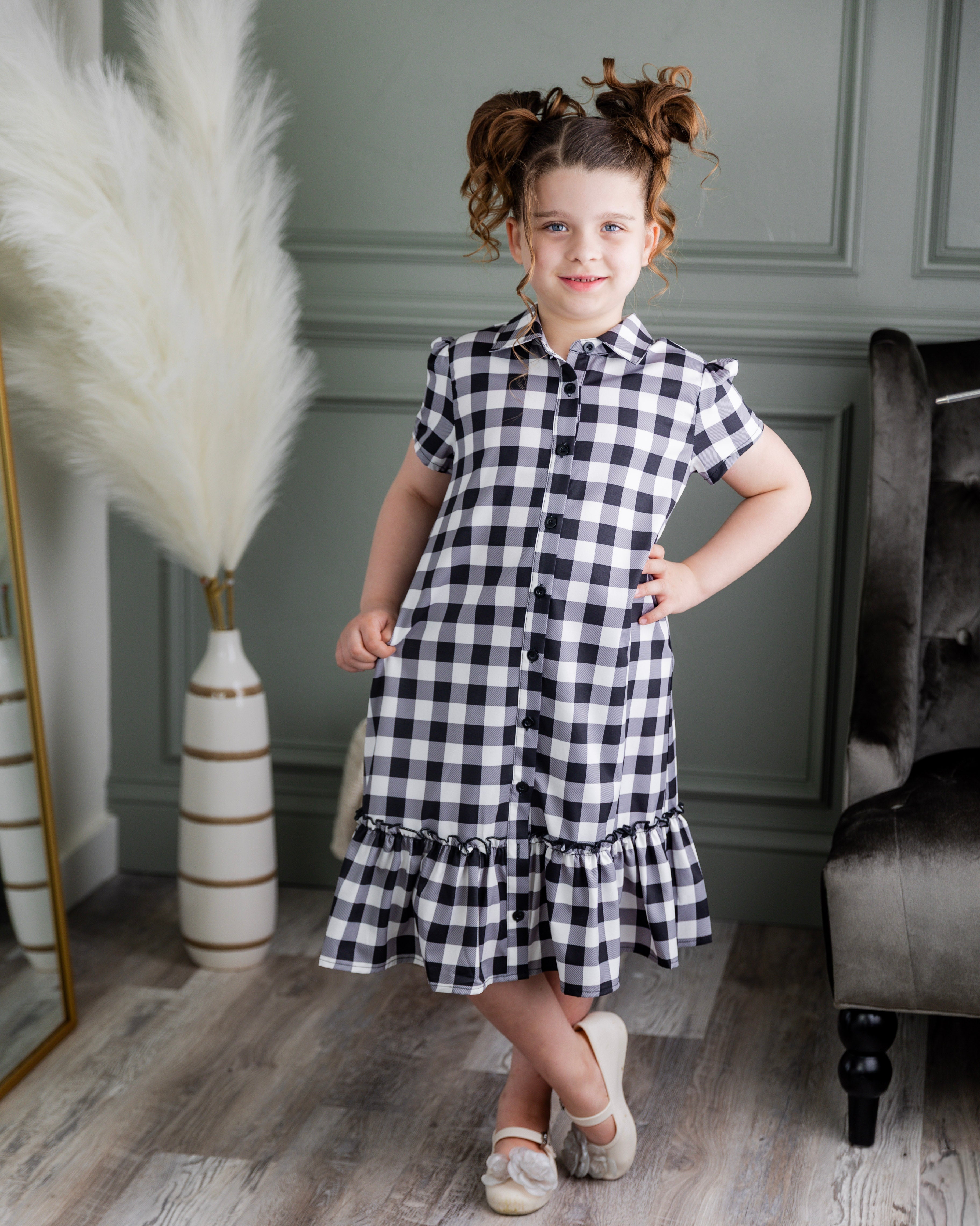 Model wearing Nuggles® Girls' Ellie Dress Dress in Storybook Check
