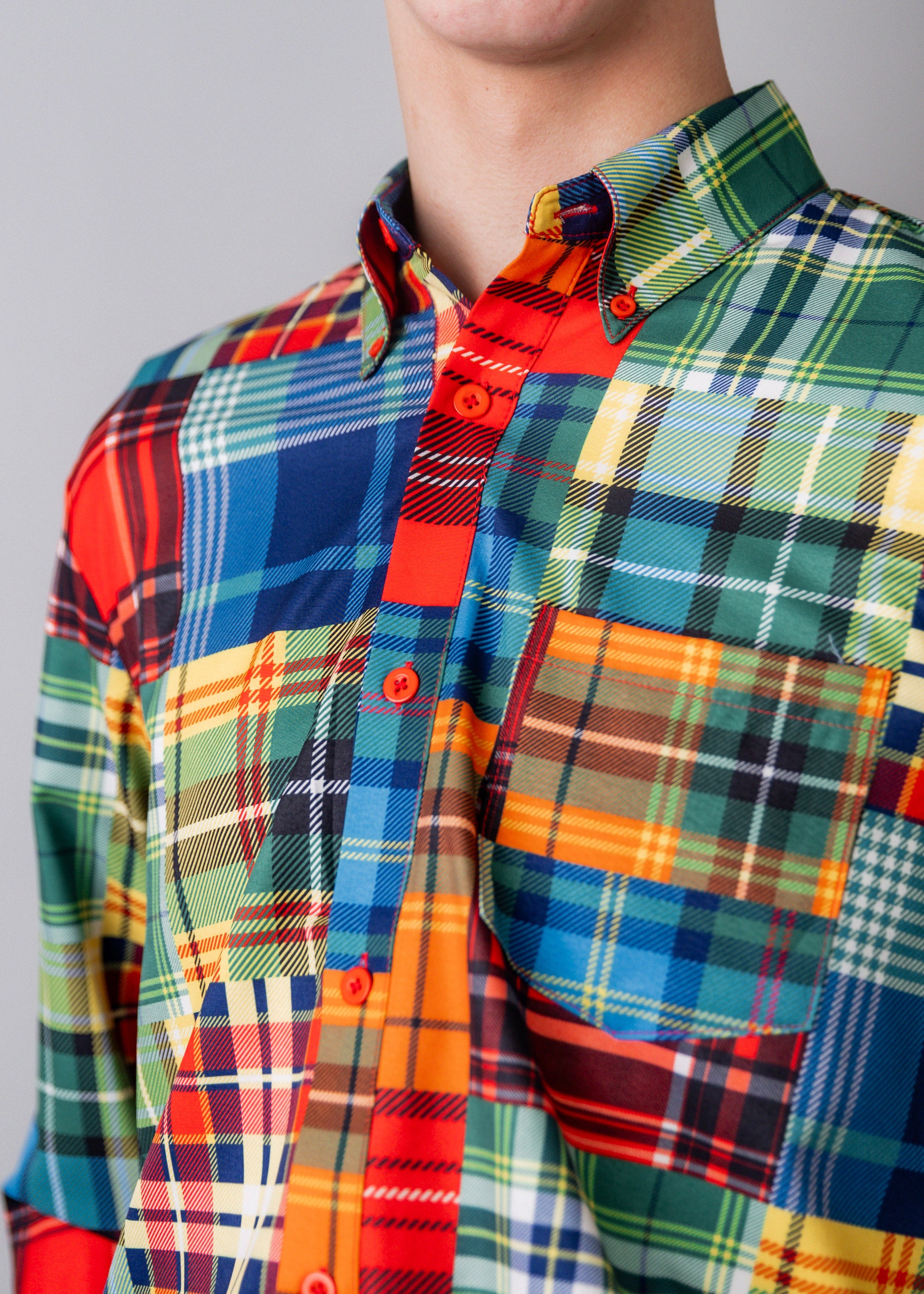 Model wearing Nuggles® Men's Button Down Shirt in Patch Plaid