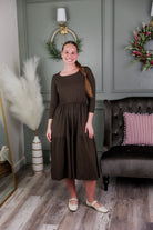 Model wearing Modest Nuggles® Nova Dress in Chocolate Brown
