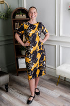 Model wearing Modest Nuggles® Aviva Dress in Golden Drift
