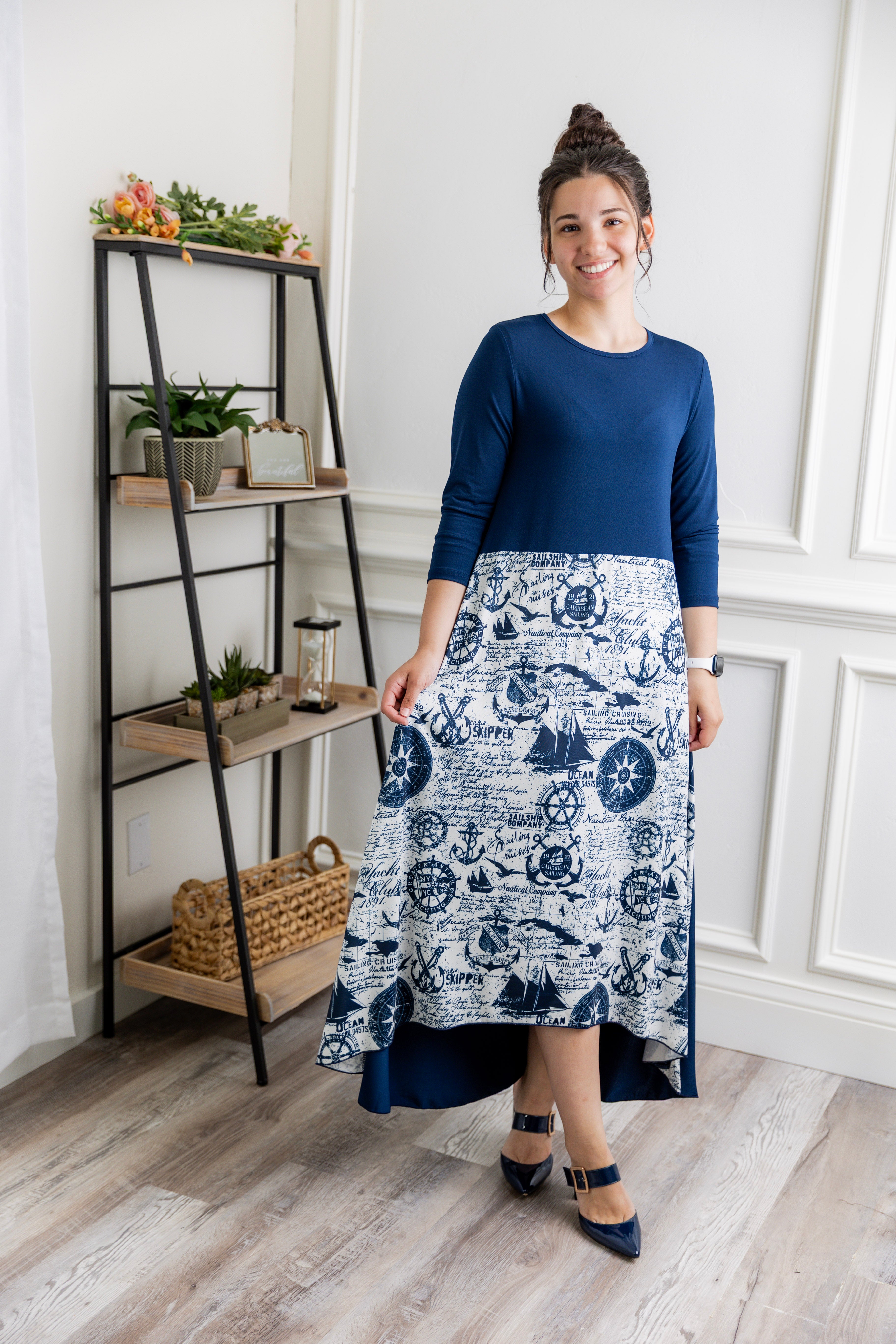 Model modeling Nuggles® Charay Dress with ¾ sleeves and high-low hem. Modest and stylish A-line dress with flattering fit.