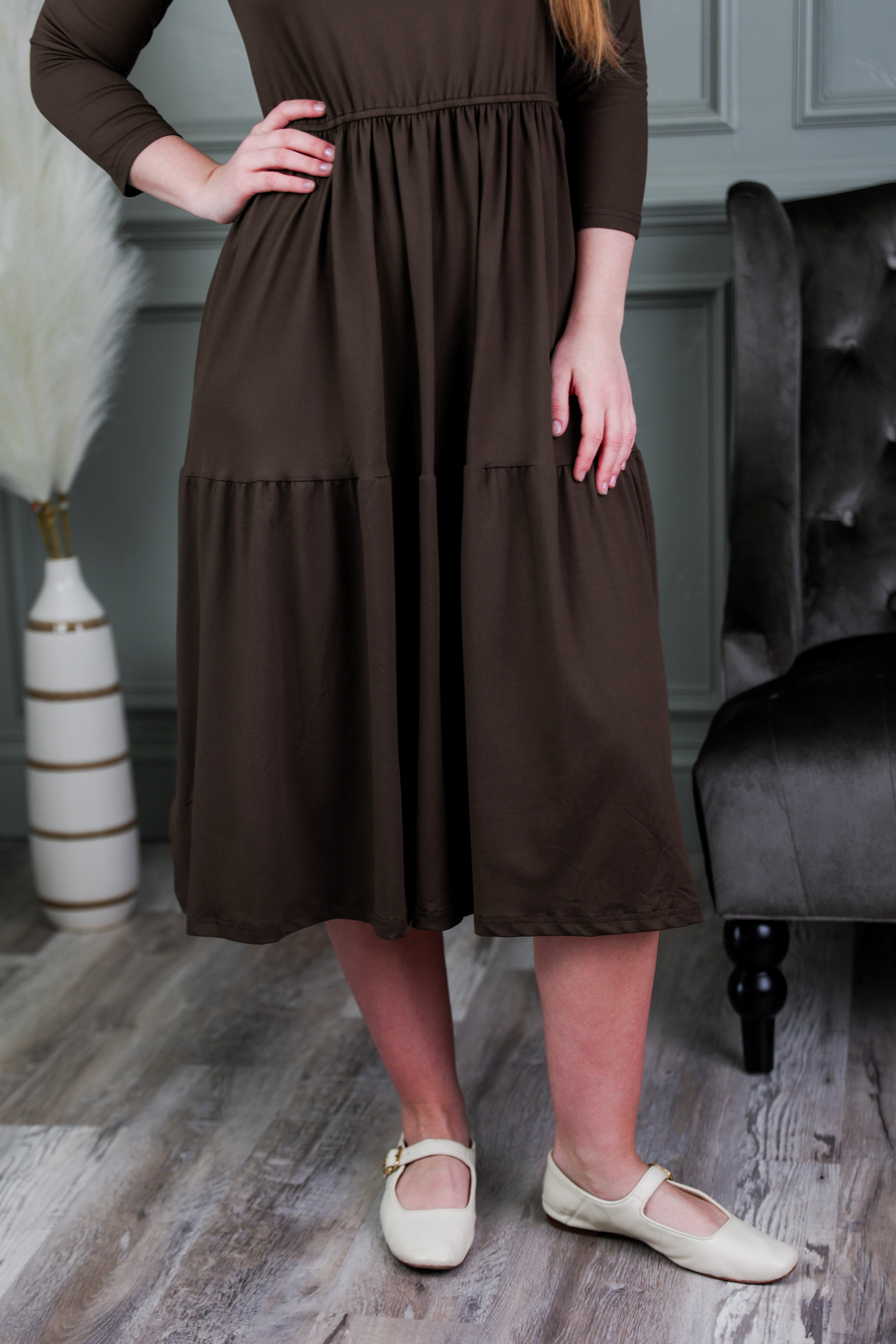 Model wearing Modest Nuggles® Nova Dress in Chocolate Brown