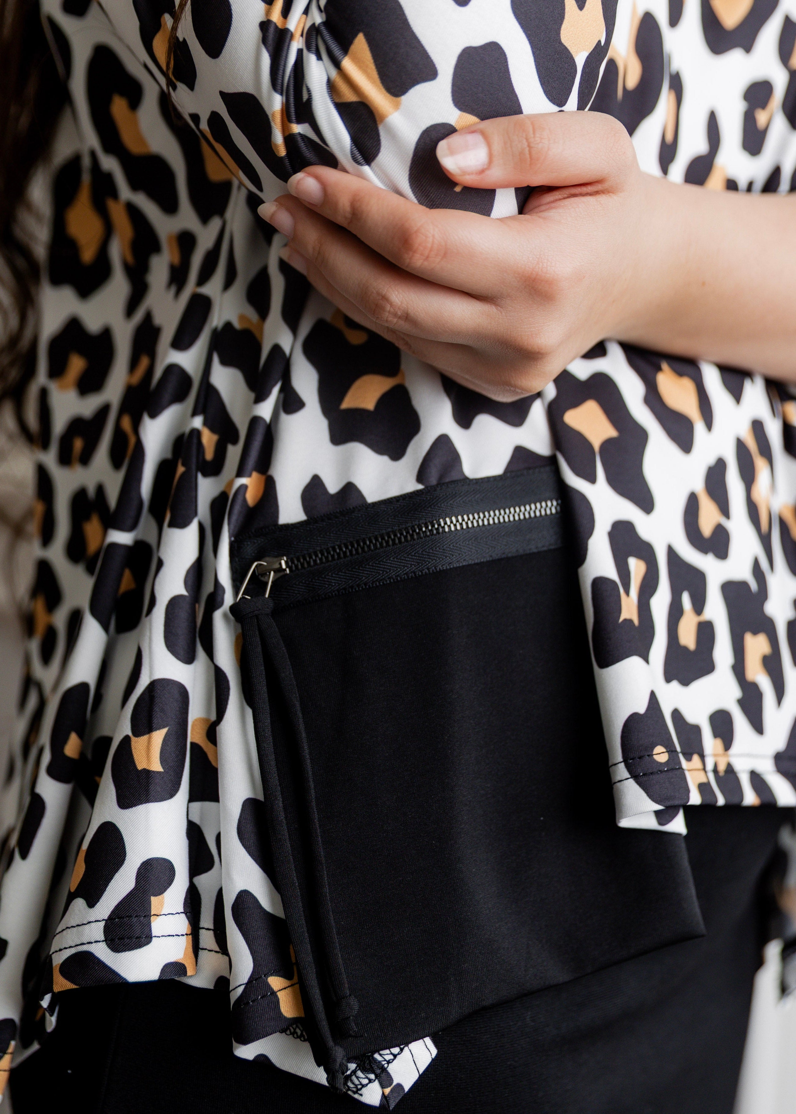 Model wearing the Nuggles® Keegan Top in Honey Leopard print modest boutique top