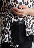 Model wearing the Nuggles® Keegan Top in Honey Leopard print modest boutique top