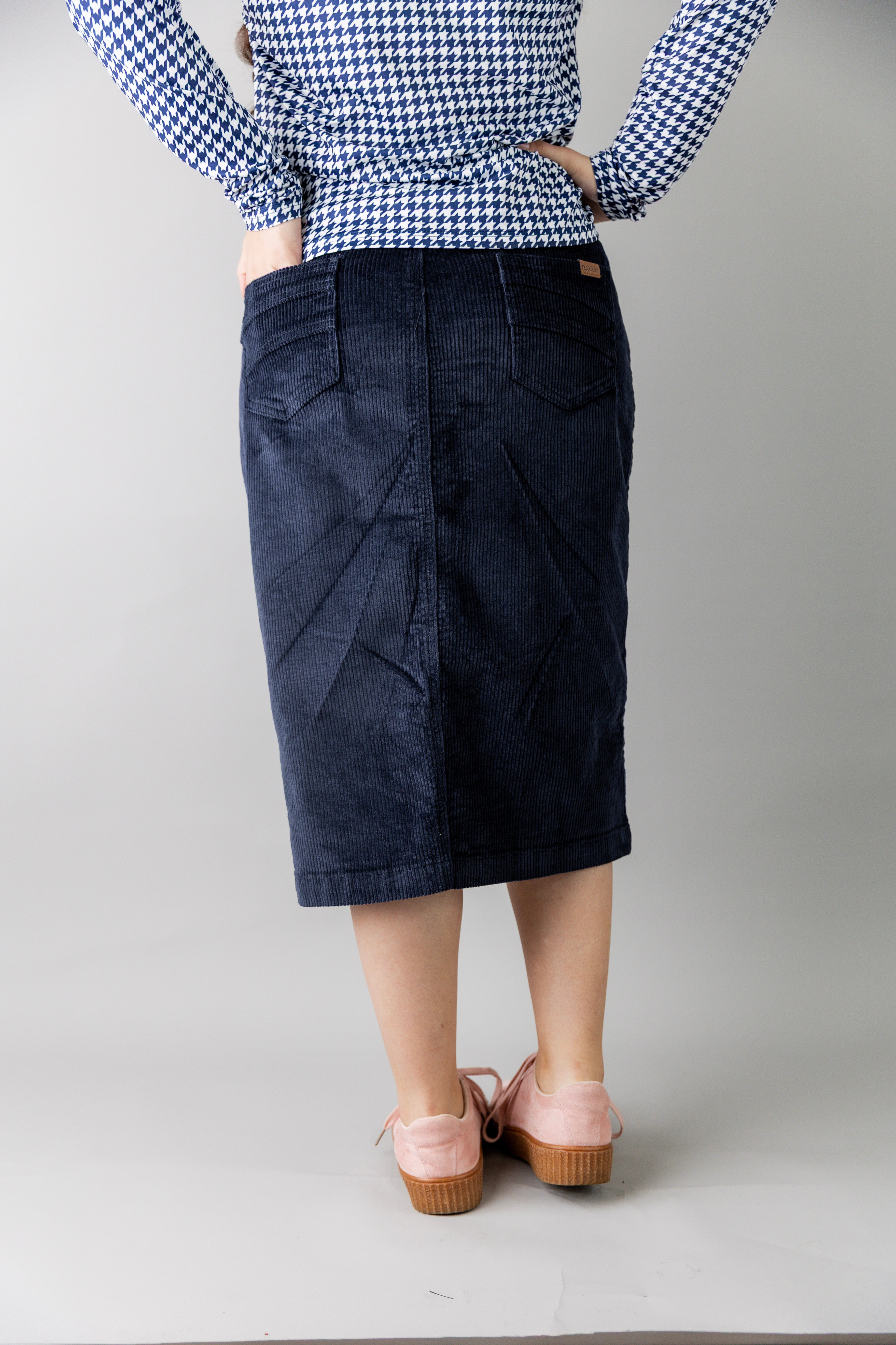 Model wearing Nuggles® 27-inch corduroy skirt
