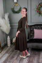 Model wearing Modest Nuggles® Nova Dress in Chocolate Brown