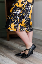 Model wearing Modest Nuggles® Aviva Dress in Golden Drift