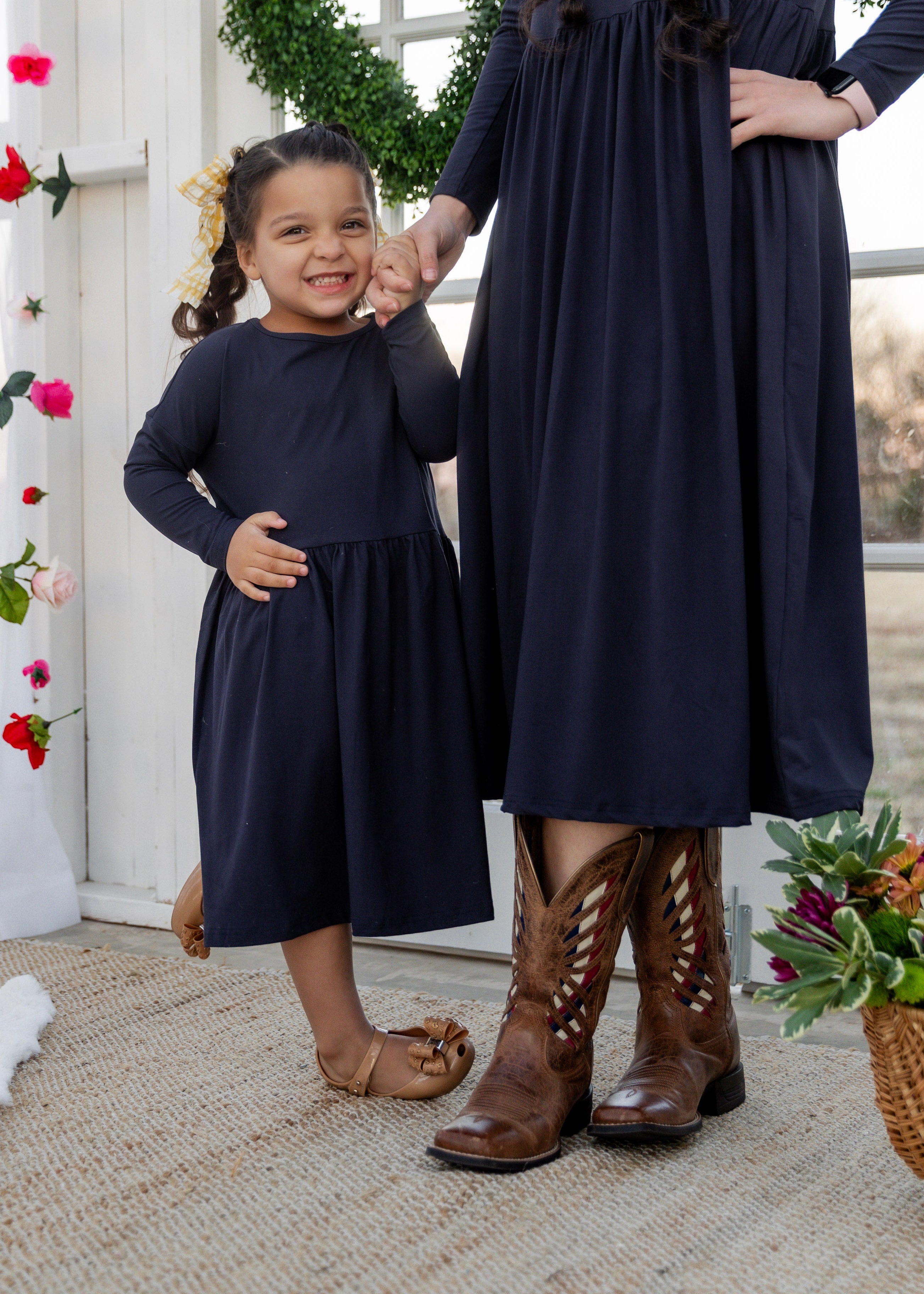Model wearing the Nuggles® Girls' Farah Dress in Navy