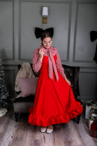 Model wearing Nuggles® Felicity top with large bow tie neckline, modest women's blouse.