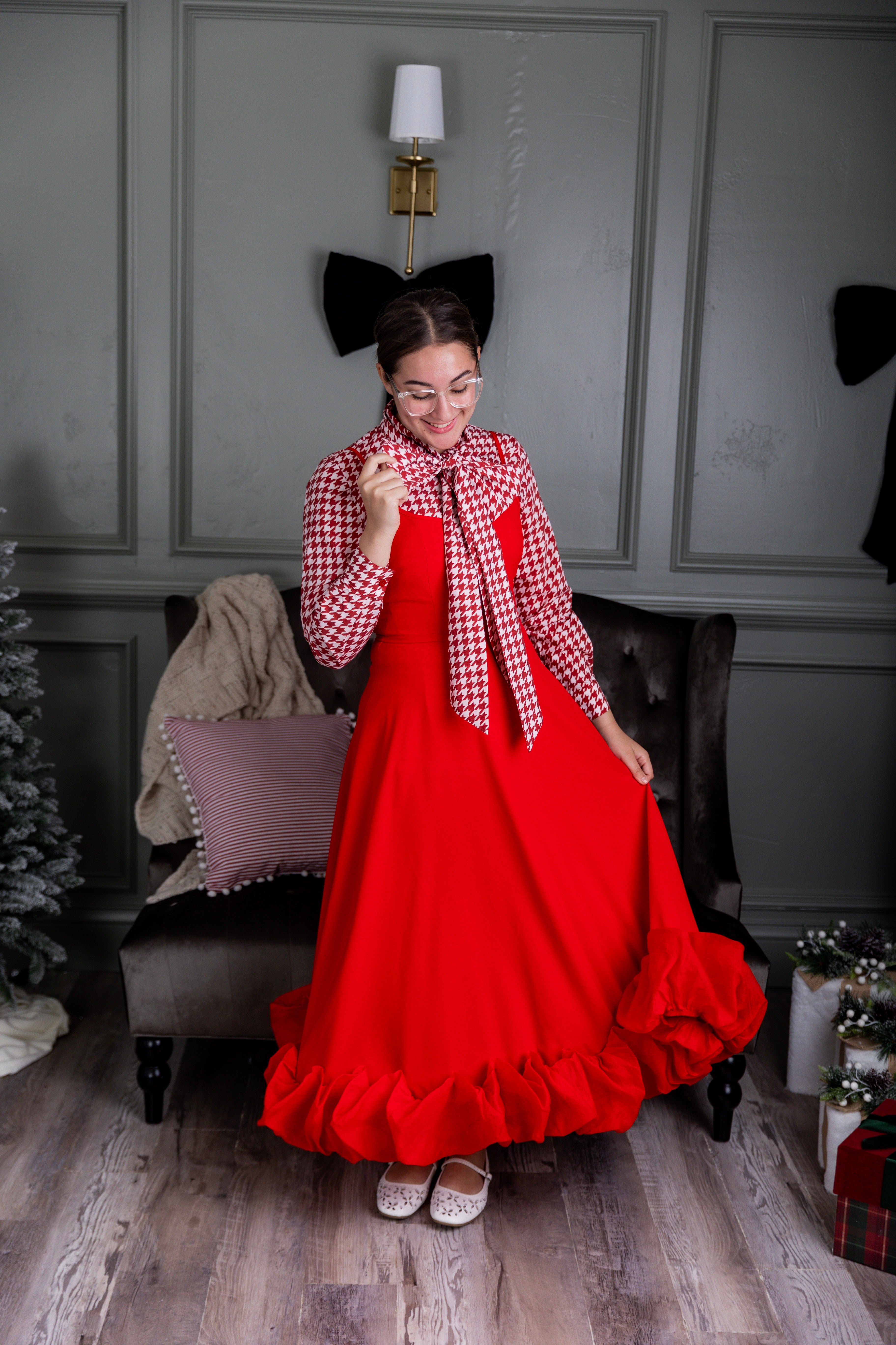 Model wearing Nuggles® Felicity top with large bow tie neckline, modest women's blouse.