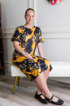 Model wearing Modest Nuggles® Aviva Dress in Golden Drift