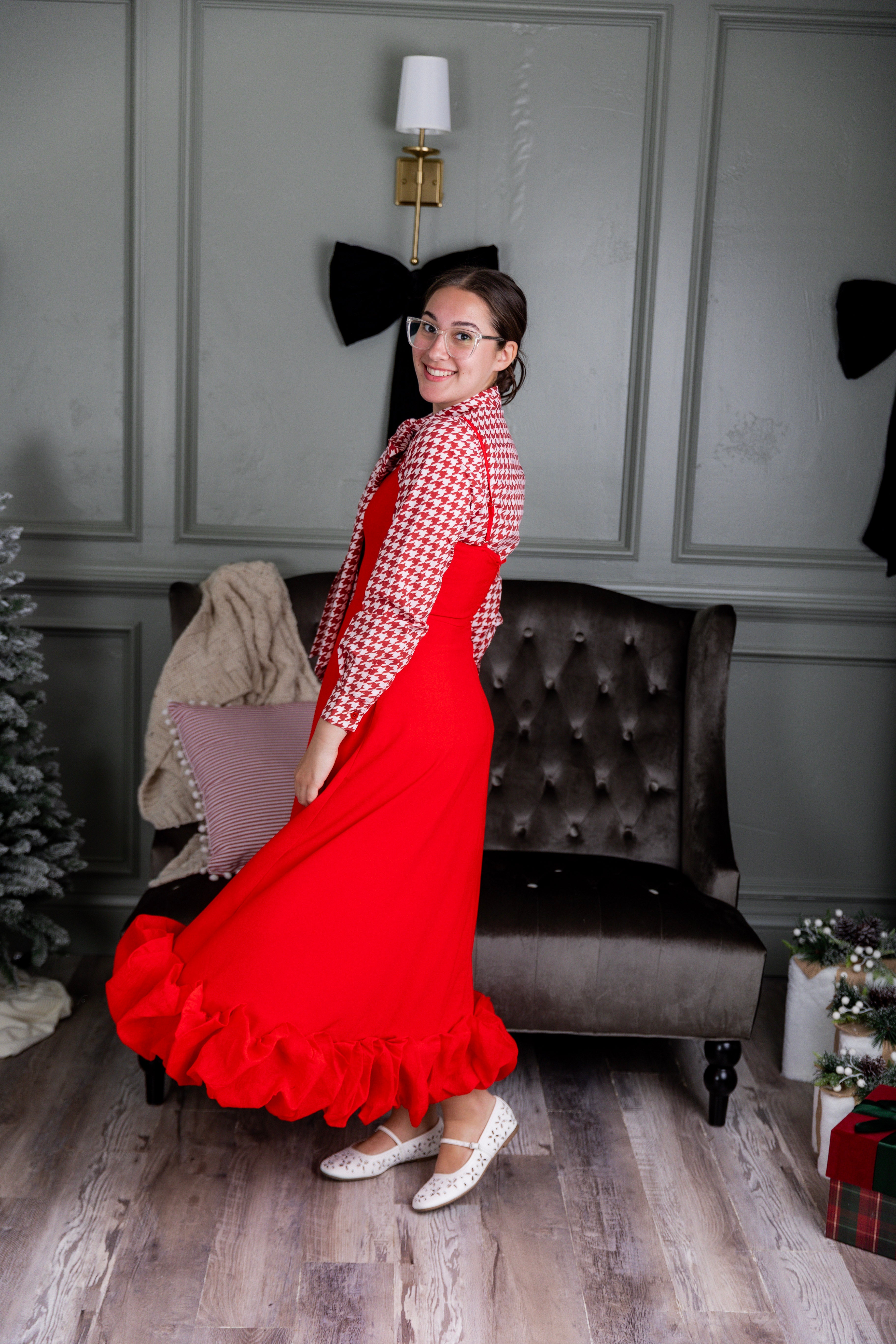 Model wearing Nuggles® Felicity top with large bow tie neckline, modest women's blouse.