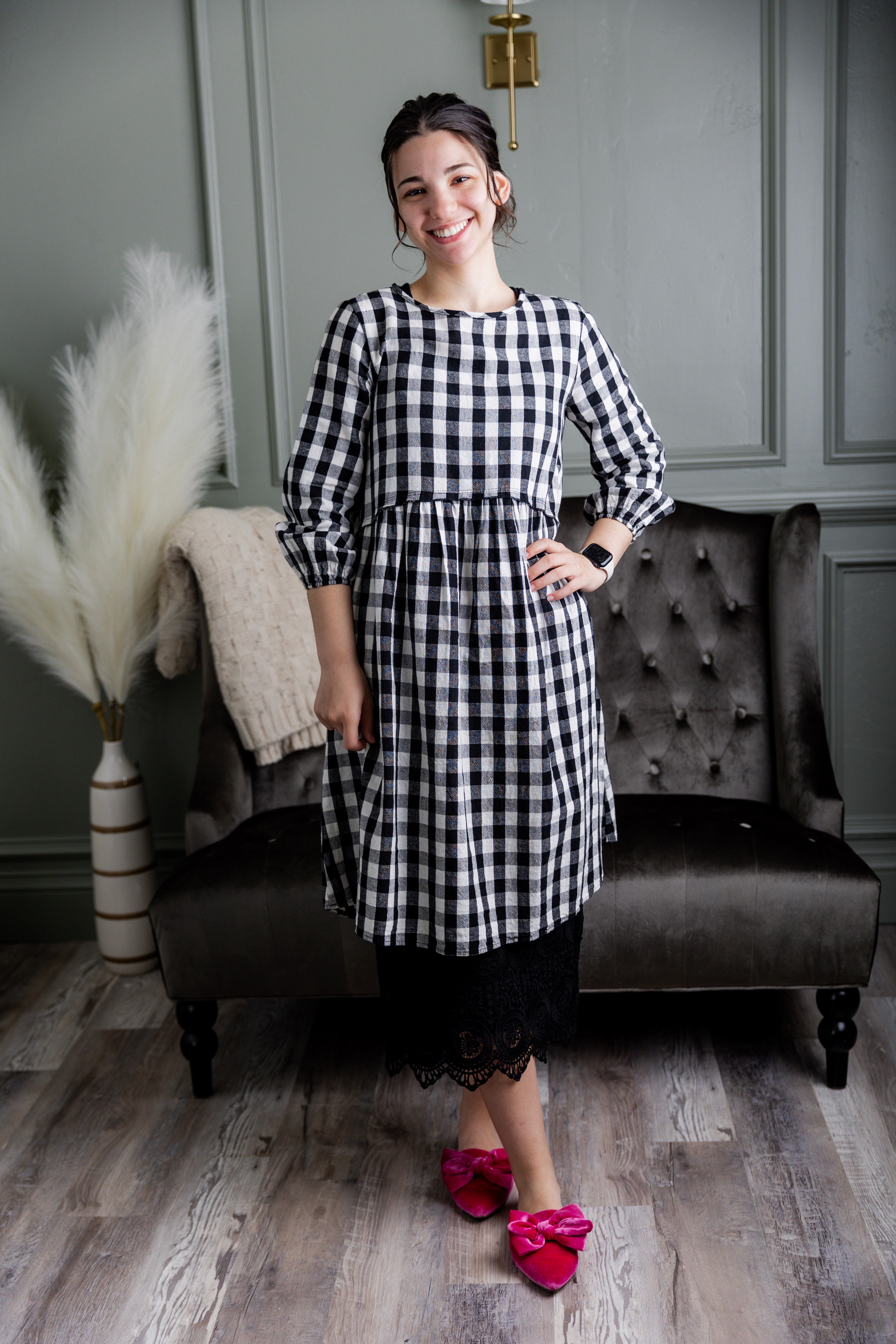 Model wearing our modest Nuggles® 27" crochet lace slip in Black